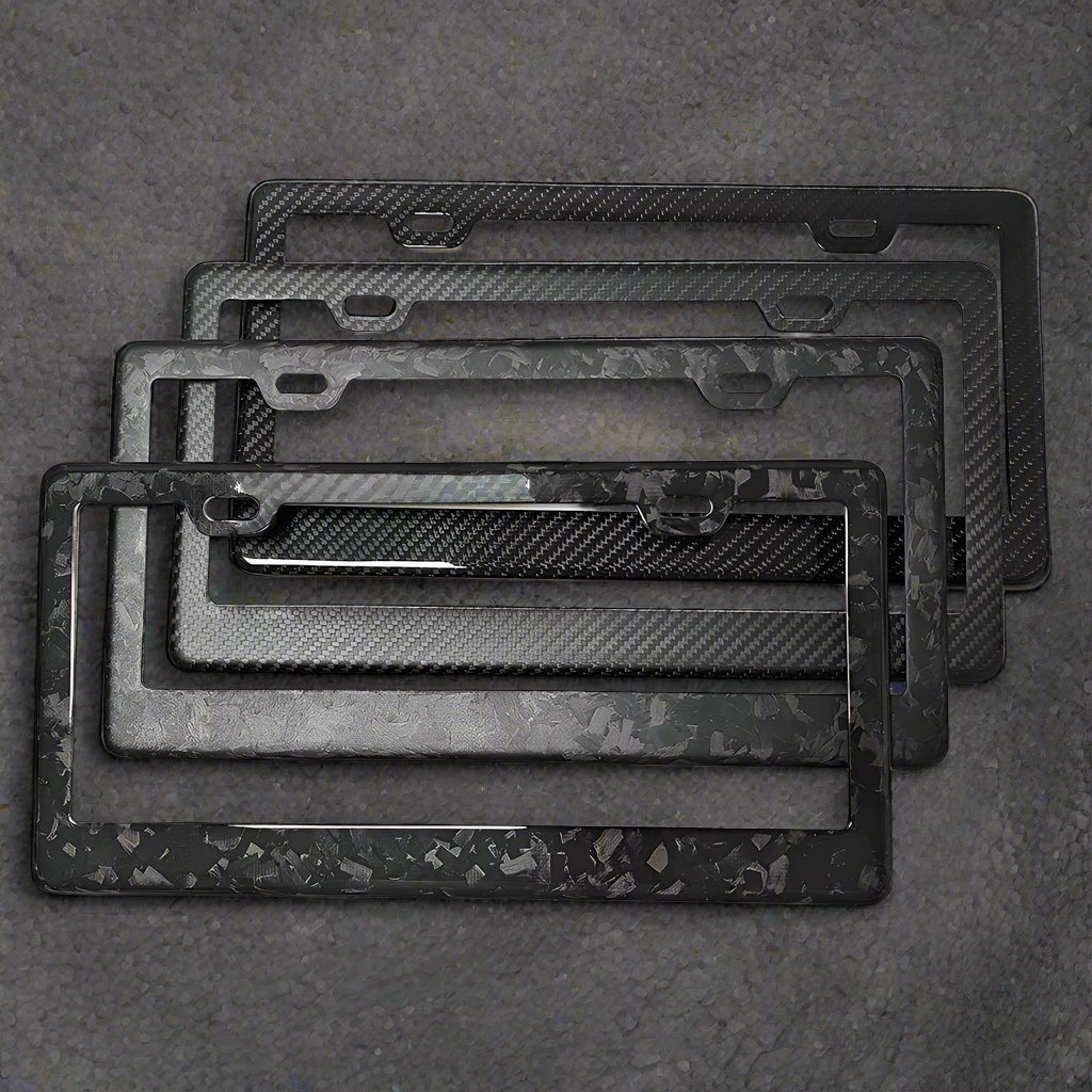 Set of carbon fiber texture license plate frames on a white background
